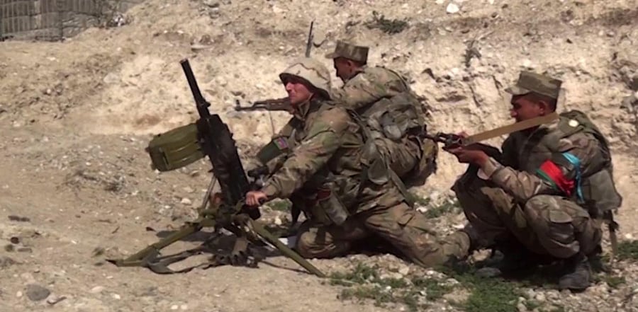 Azeri troops conducting a combat operation during clashes between Armenian separatists and Azerbaijan in the breakaway region of Nagorno-Karabakh. Credit: AFP Photo