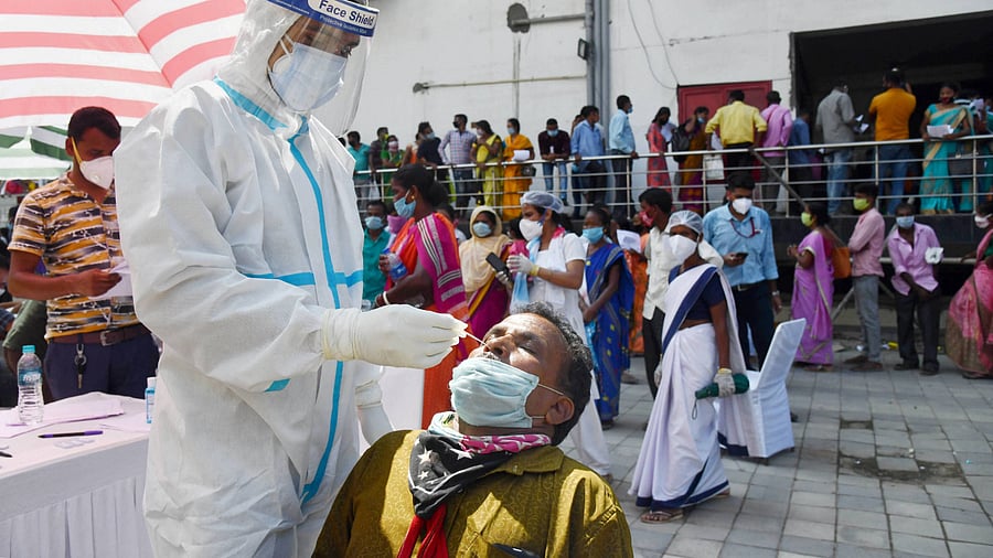  health worker takes samples for Covid-19 Rapid Antigen Test. Credits: PTI Photo