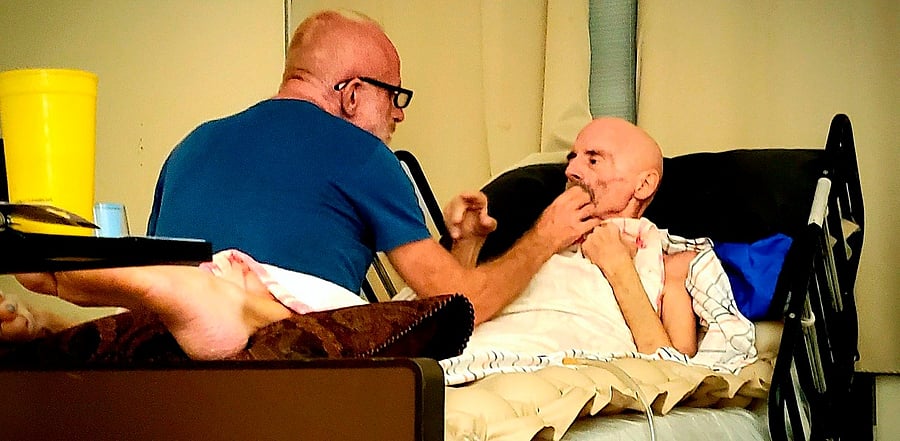 Timothy Ray Brown in home hospice with his partner, Tim Hoeffgen(L). Credit: AFP Photo