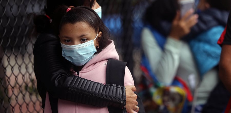 Elementary school students are welcomed back as public schools open for in-person learning. Credit: AFP Photo