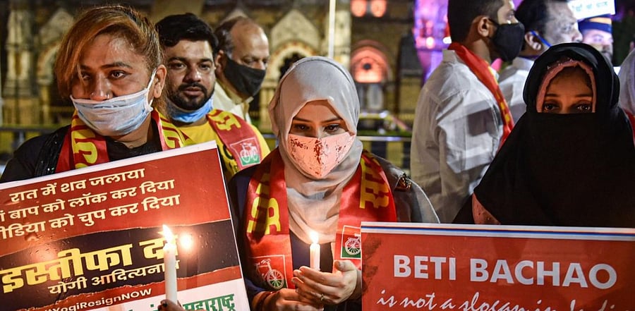  Activists hold placards and light candles demanding justice for the Hathras gang-rape victim, outside CST, in Mumbai, Wednesday, Sept. 30, 2020. (PTI Photo)