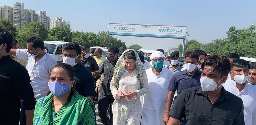  AICC General Secretary Priyanka Gandhi Vadra on her way to Hathras along with party workers to meet the family members of a 19-year-old Dalit woman who was murdered and gang-raped two weeks ago after her vehicle was stopped by the authorities, at Yamuna Expressway in Noida. Credit: PTI Photo