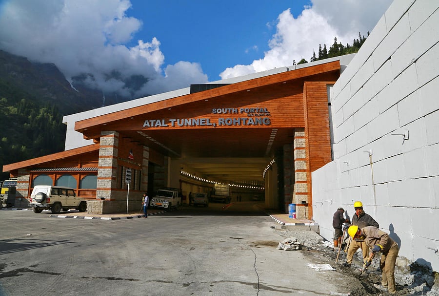 Labourers work next to the newly constructed Atal Tunnel on the Leh-Manali highway in Dhundi village in Kullu district in the northern state of Himachal Pradesh. Credit: Reuters