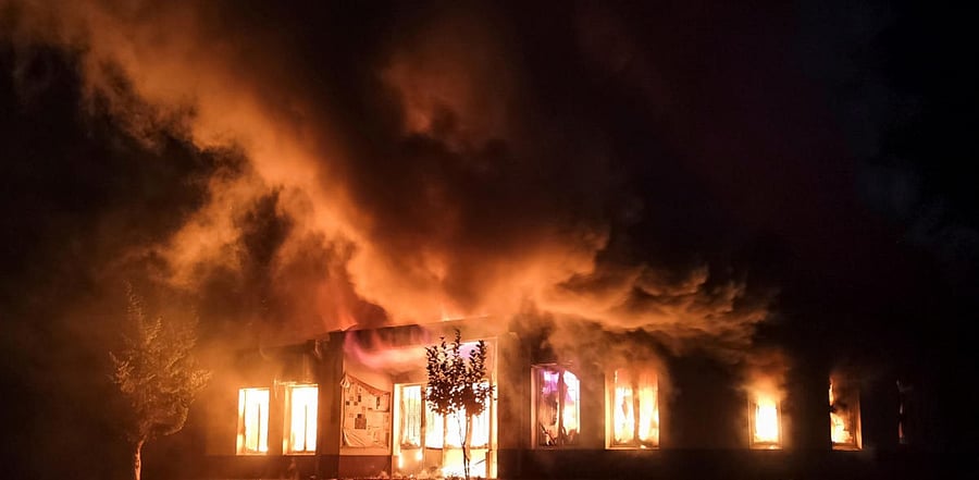 A shop is seen on fire following recent shelling during a military conflict over the breakaway region of Nagorno-Karabakh in Stepanakert. Credit: Reuters