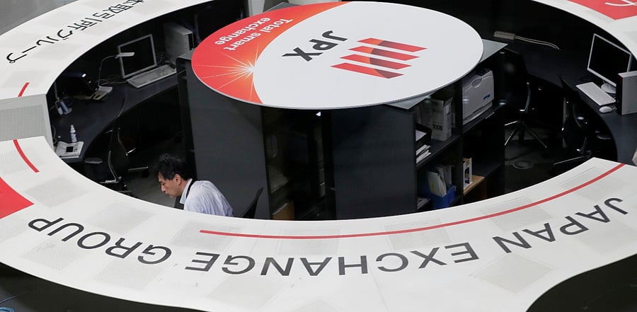 A man works at the Tokyo Stock Exchange after market opens in Tokyo. Credit: Reuters Photo