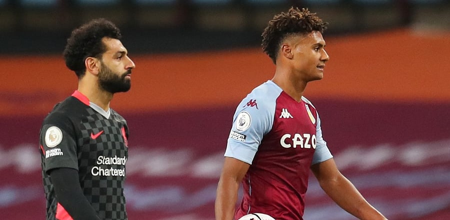 Aston Villa's Ollie Watkins celebrates with the match ball after the match alongside Liverpool's Mohamed Salah. Credit: Reuters Photo