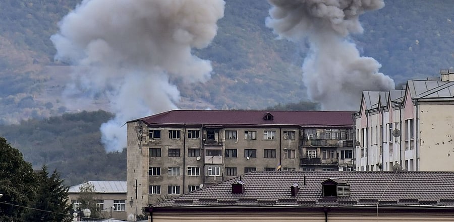 Smoke rises after shelling in Stepanakert on October 9, 2020, during ongoing fighting between Armenia and Azerbaijan over the disputed region of Nagorno-Karabakh. Credit: AFP Photo