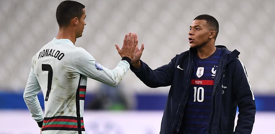 Portugal's forward Ronaldo (L) greets France's forward Kylian Mbappe at the end of the Nations League football match between France and Portugal, on October 11, 2020 at the Stade de France in Saint-Denis, outside Paris. Credit: AFP Photo