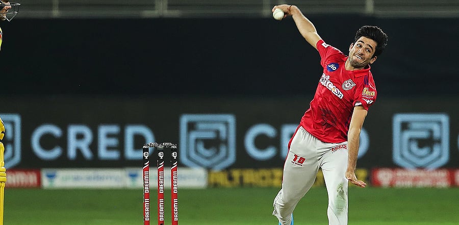 Kings XI Punjab player Ravi Bishnoi bowls during a match against the Chennai Super Kings in Sharjah. Credit: PTI Photo