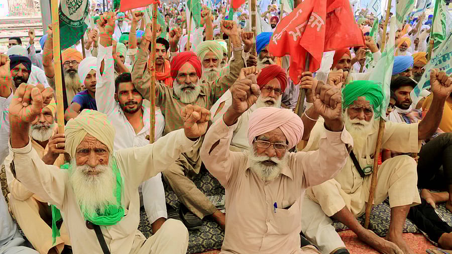 Farmers block rail tracks during their agitation over new farm laws. Credits: PTI Photo