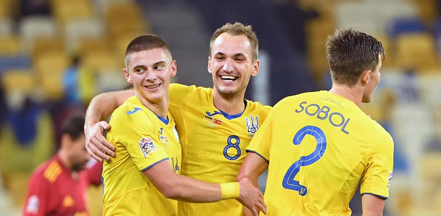 Ukraine's Vitaliy Mykolenko, Ukraine's midfielder Yevhen Makarenko and Ukraine's defender Eduard Sobol celebrate after the UEFA Nations League football match between Ukraine and Spain at the Olympiyskiy stadium in Kiev. Credit: AFP Photo