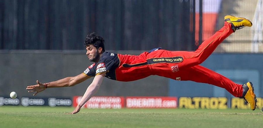 Washington Sundar of Royal Challengers Bangalore dives to stop the ball during IPL 2020 cricket match. Credit: PTI