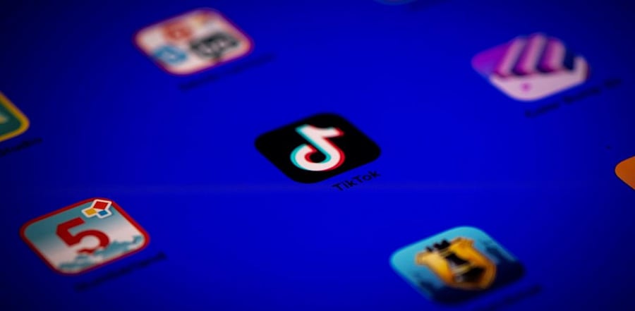 Logo of the social media video sharing app Tiktok displayed on a tablet screen. Credit: AFP