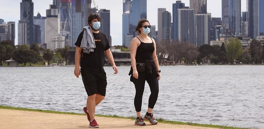 People walk around Melbourne's Albert Park Lake. Representative Photo. Credit: AFP