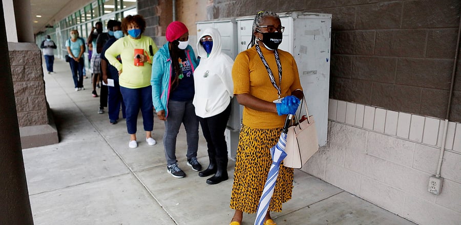 Florida resident Sheila Williams waits in line to cast her ballot at the Hiawassee Library polling station as early voting begins ahead of the election in Orlando, Florida. Credit: Reuters Photo