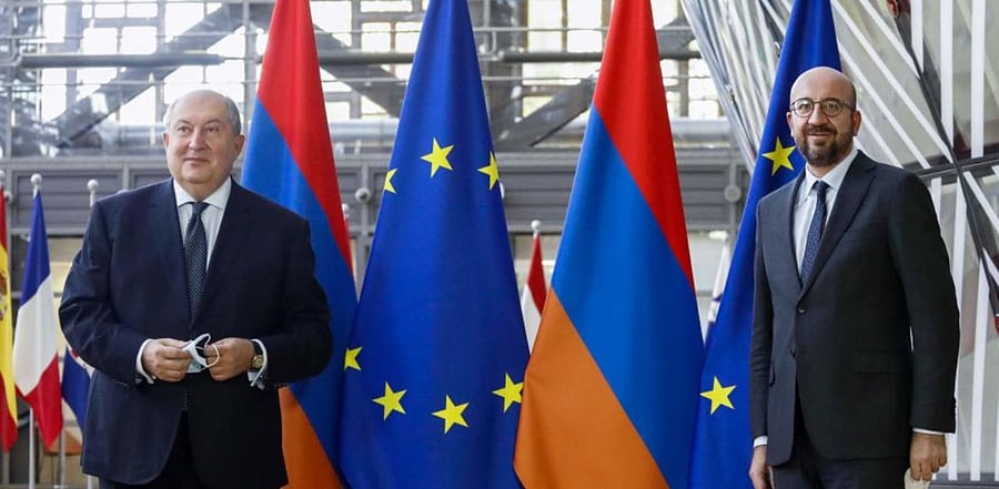 Armenian President Armen Sarkissian (L) poses with European Council President Charles Michel prior to a meeting in Brussels. Credit: AFP