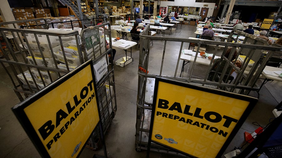Some of the hundreds of thousands of early mail-in ballots are processed for scanning by election workers at the Orange County Registrar of Voters in Santa Ana, California. Credits: Reuters Photo