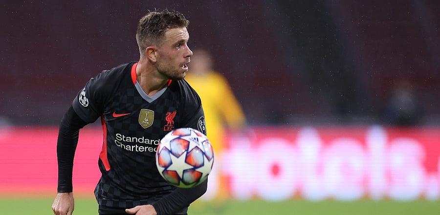 Liverpool's English midfielder Jordan Henderson runs for the ball during the UEFA Champions League Group D first-leg football match between Ajax Amsterdam and Liverpool FC at the Johan Cruijff Arena in Amsterdam. Credit: AFP Photo