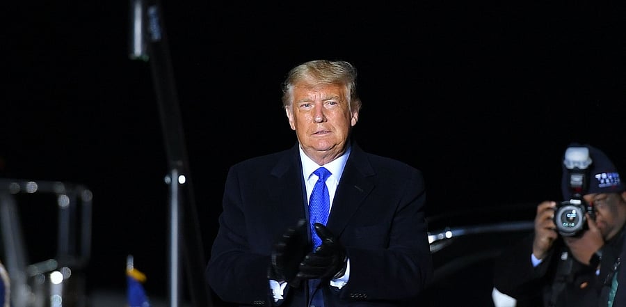 US President Donald Trump arrives to speak during a campaign rally at Waukesha County Airport in Waukesha. Credit: AFP Photo