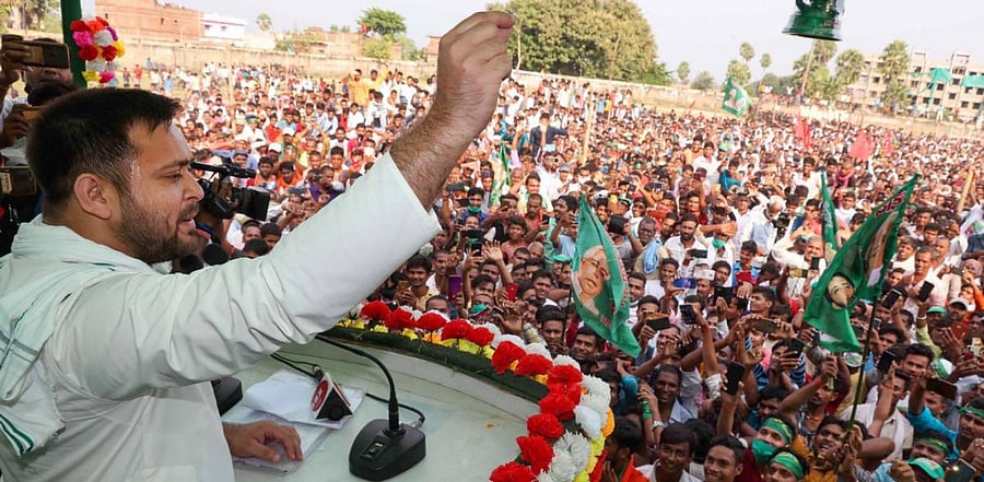 RJD leader Tejashwi Prasad Yadav addresses a gathering during an election rally for the upcoming Bihar assembly elections, in Munger district, Saturday, Oct, 24, 2020. Credit: PTI Photo