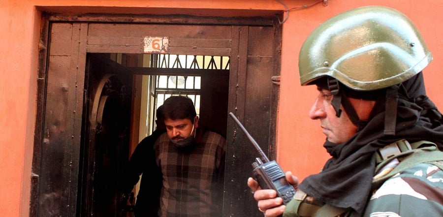 National Investigation Agency (NIA) officials come out of the Greater Kashmir office after conducting a raid, at Press Colony in Srinagar, Wednesday, Oct. 28, 2020. Credit: PTI Photo