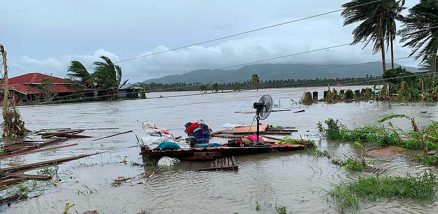 An electric fan and belongings are seen on the floor of a destroyed house after tropical storm Molave hit the town of Pola, Oriental Mindoro province. Credit: AFP Photo