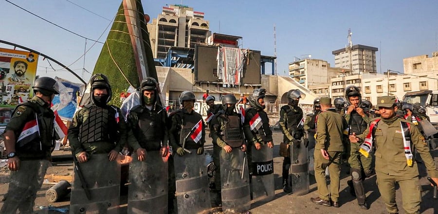 Members of the Iraqi security forces stand guard during the reopening of the Iraqi capital Baghdad's central Tahrir Square. Credit: AFP