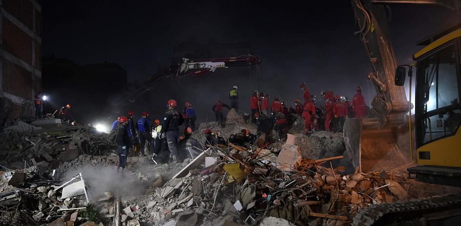 Search and rescue teams look for victims at the site of a collapsed building in Izmir on November 2, 2020, after a powerful earthquake struck Turkey's western coast and parts of Greece two days ago. Credit: AFP Photo