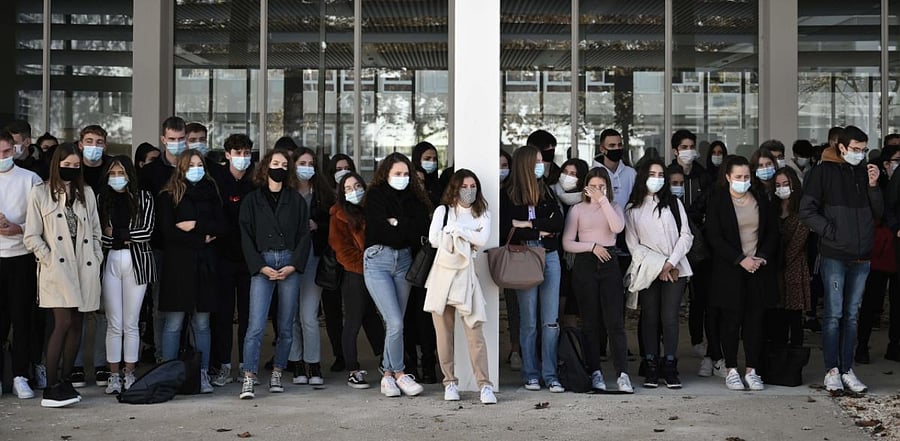 Students and teachers gather at the Aragon secondary school in Muret on November 02, 2020, in homage to slain history teacher Samuel Paty, who was beheaded by an attacker for showing pupils cartoons of the Prophet Mohammed in his civics class. Credit: AFP