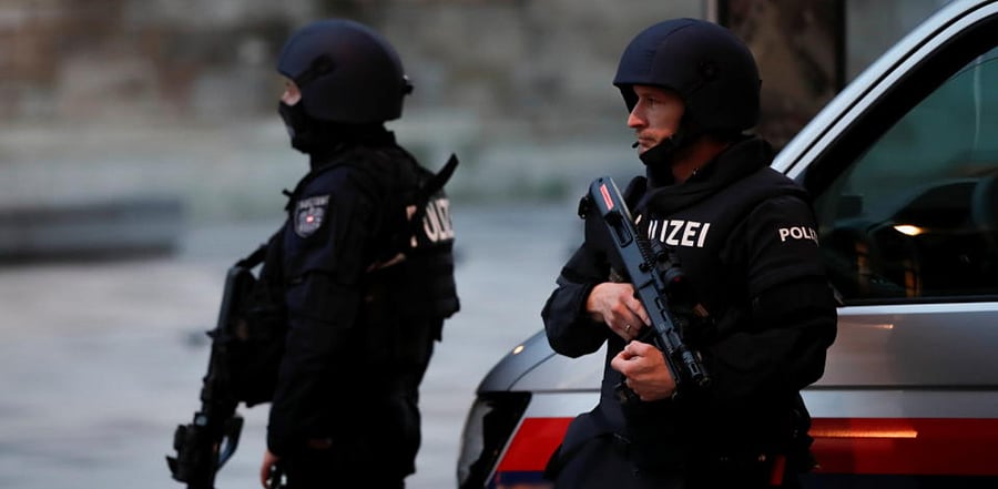 Police officers stand guard after exchanges of gunfire in Vienna, Austria November 3, 2020. Credit: Reuters Photo
