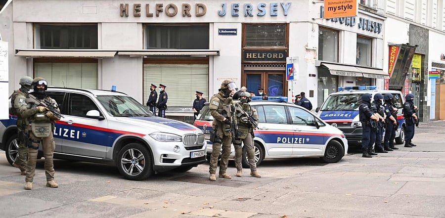 Policemen secure the area around a crime scene in Vienna. Credit: AFP