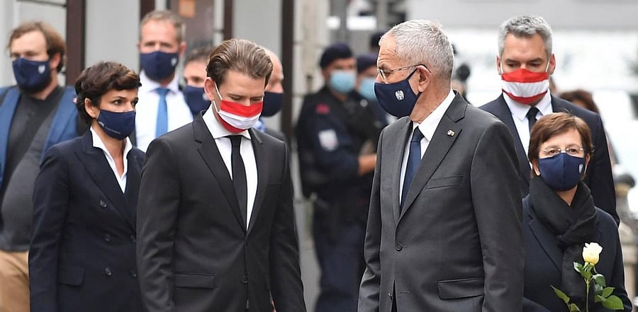 Austrian Chancellor Sebastian Kurz (C-L) and Austrian President Alexander van der Bellen (C-R) arrive to pay their respects to the victims of a shooting in Vienna. Credit: AFP.