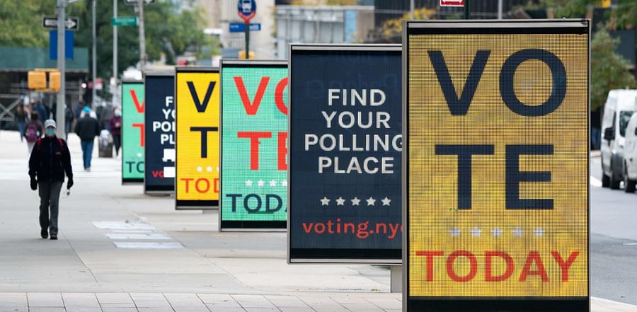 Video billboards urge people to vote at Lincoln Center on Election Day, November 3, 2020 in New York. Credit: AFP