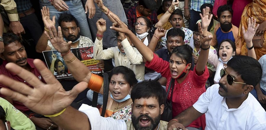 Members of Bharatiya Janata Yuva Morcha stage a demonstration against the state government over the law and order situation in West Bengal, in Kolkata. Credit: PTI Photo