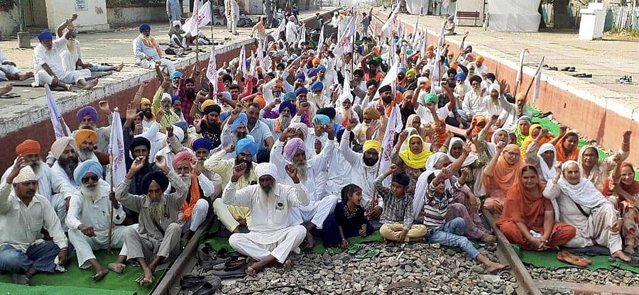Farmers block railway tracks during a protest against the new farm bills, at Jandiala Guru in Amritsar. Credit: PTI file photo