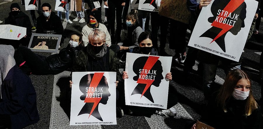 Demonstrators block a street during an anti-government protest following the ruling by Poland's Constitutional Tribunal that imposes a near-total ban on abortion, in Warsaw, Poland. Credit: Reuters Photo