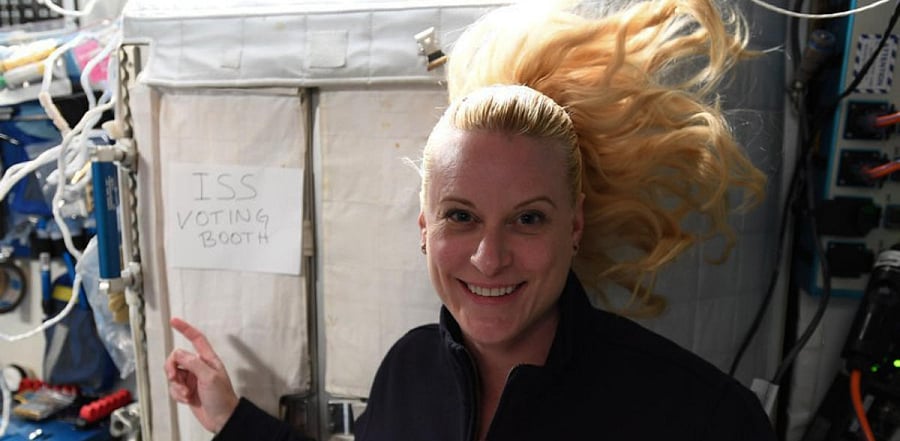 US astronaut Kate Rubins casts her vote for the US presidential elections. Credit: AFP Poto