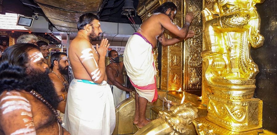 Priests perform rituals for the 'Tulamas Puja' at the Sabarimala temple. Credit: PTI.