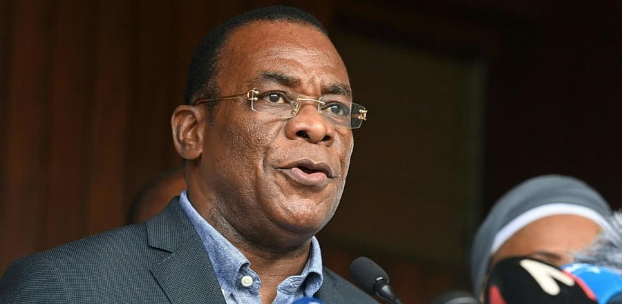 Ivorian Opposition spokesman and candidate Pascal Affi N'Guessan (R) speaks during a press conference to call for political transition in Ivory Coast. Credit: AFP