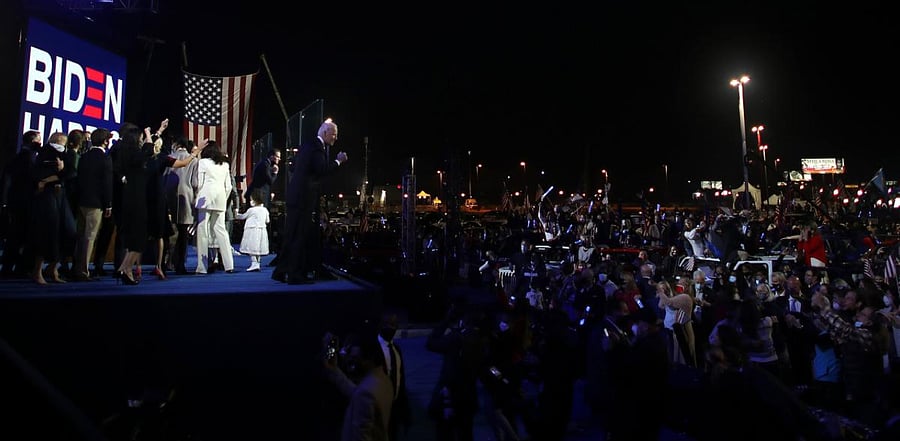 US President-elect Joe Biden and family members salutes the crowd after delivering remarks in Wilmington, Delaware. Credit: AFP Photo