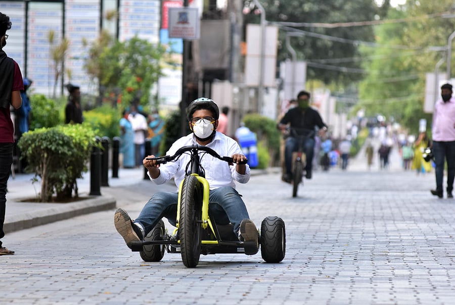 A man rides an electric cycle on Church Street on Saturday, the first day of a months-long weekend ban on motorised traffic. DH PHOTOS/JANARDHAN B K