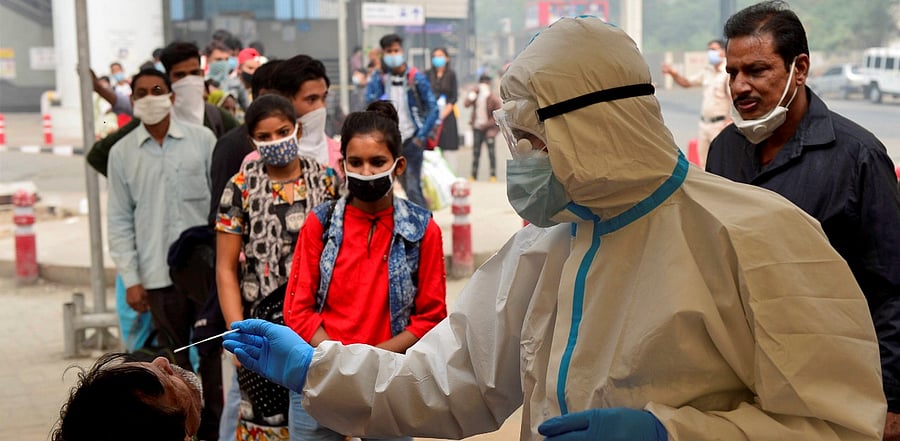 A health worker conducts Covid-19 RAT test. Credit: PTI Photo