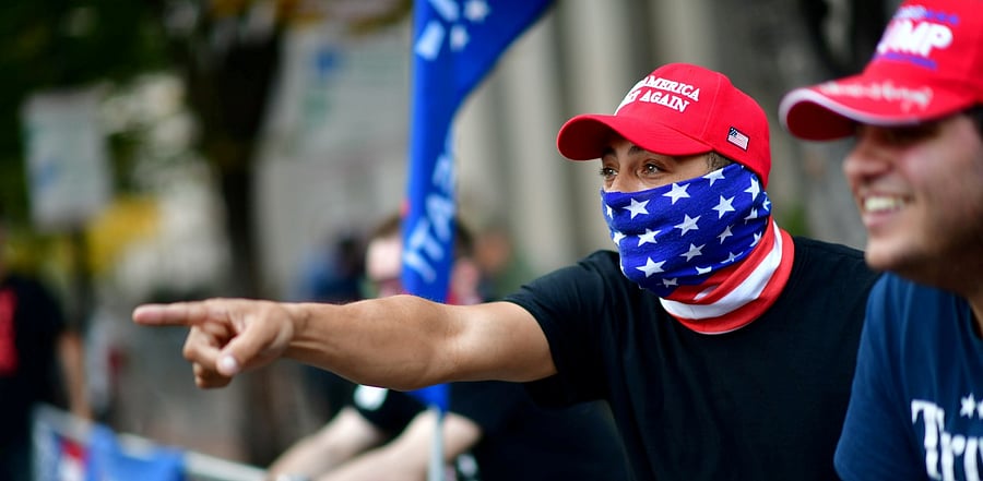 Supporters of US President Donald Trump shout across the street at supporters of President-elect Joe Biden the day after a presidential election victory was called for Biden, in Philadelphia, Pennsylvania. Credit: Reuters Photo