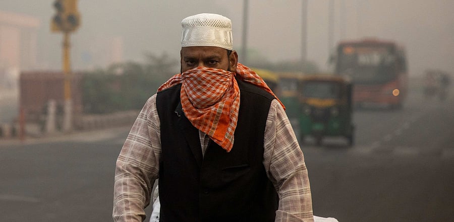 An apocalyptic smog enveloped Delhi in grey on Tuesday, blotting out the sun from the sky and smudging landmarks from view as the air quality hit "emergency" levels. Credit: Reuters photo