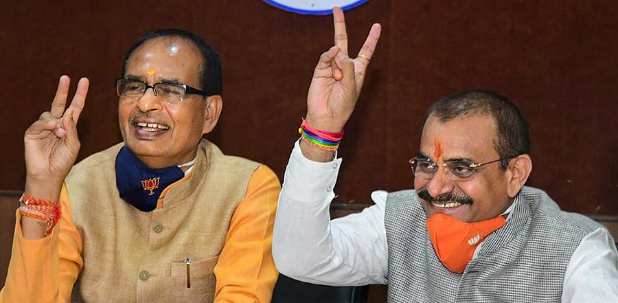  Madhya Pradesh Chief Minister Shivraj Singh Chouhan and BJP State President V D Sharma. Credit: PTI photo