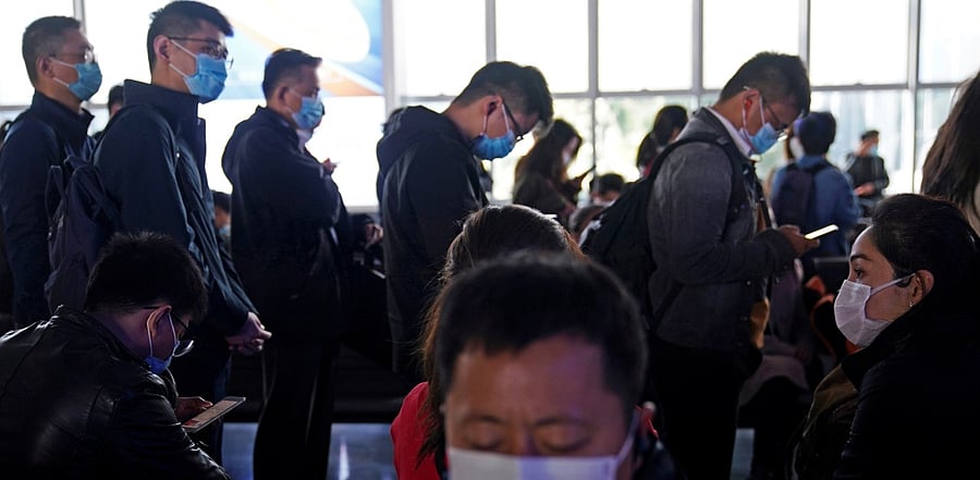 People wear face masks amid the global outbreak of the coronavirus in China. Credit: Reuters Photo