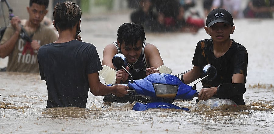 Typhoon Vamco packed winds of up to 155 kilometres (96 miles) per hour as it swept across Luzon after making landfall overnight, with authorities warning of landslides and potentially deadly storm surges along the coast. Credit: AFP