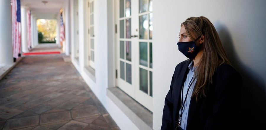 A US Secret Service agent wearing a protective face mask stands at her post on the White House West Wing. Credit: Reuters Photo