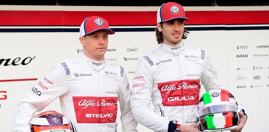 Alfa Romeo Sauber F1's Finnish driver Kimi Raikkonen (L) and Alfa Romeo Sauber F1's Italian driver Antonio Giovinazzi (R) pose after unveiling the new Alfa Romeo Sauber formula one car. Credit: AFP/file photo.