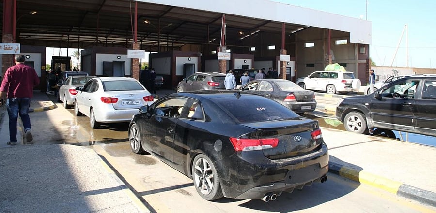 Cars in Tunisia cross to neighbouring Libya via the Ras Jedir border post, after its reopening. Credit: AFP.
